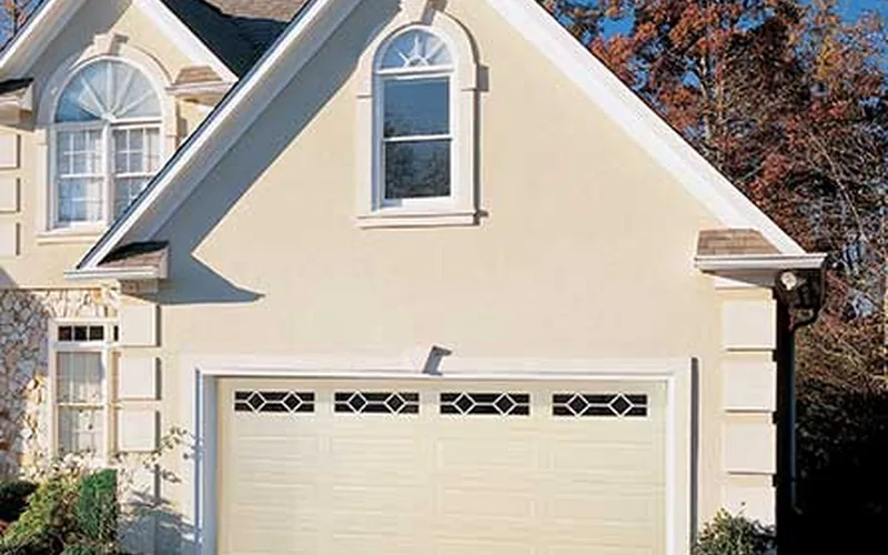 Amarr Olympus almond garage door on a stucco home